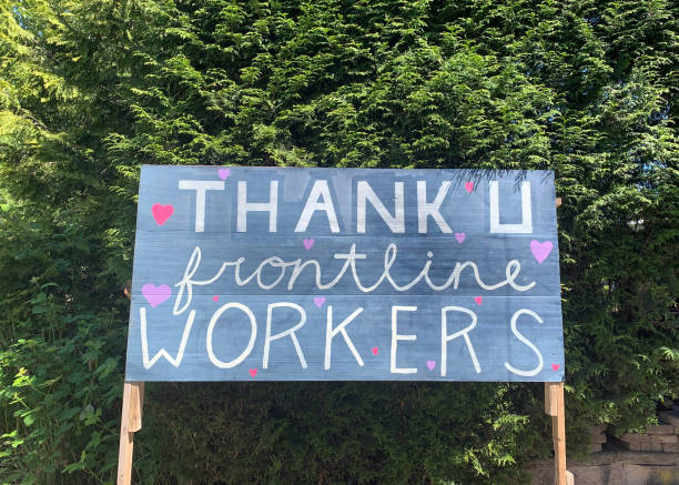 Pandemic Thank You Message Looking at a homemade billboard message to Frontline workers during the Covid-19 pandemic in suburban Vancouver, B.C. frontline worker stock pictures, royalty-free photos & images