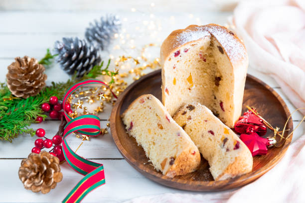 Panettone traditional Italian Christmas cake on wooden white table stock photo