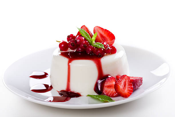 A panna cotta with fresh strawberries and compote stock photo