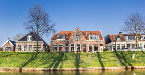 Panorama of historic houses at the canal of Steenwijk stock photo