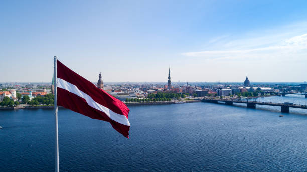 Panorama of Riga city Panorama of Riga city with a big Latvian flag in foreground latvia stock pictures, royalty-free photos & images