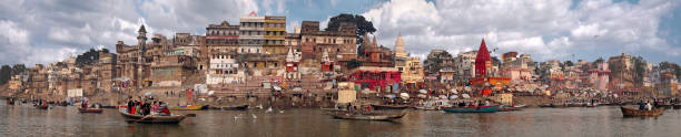 panorama of the waterfront city of Varanasi taken in India in November 2009 Panorama of the oldest and sacred city of India Varanasi made from a boat ganges river stock pictures, royalty-free photos & images