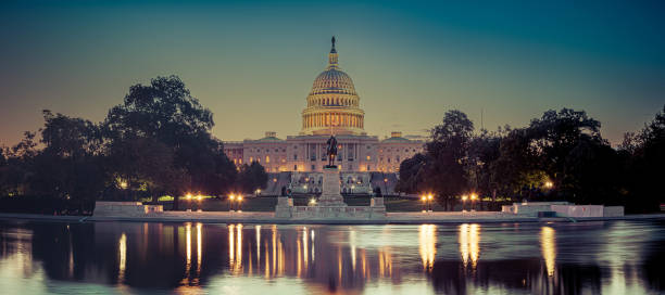 Panoramic image of the Capitol of the United States with the capitol reflecting pool stock photo