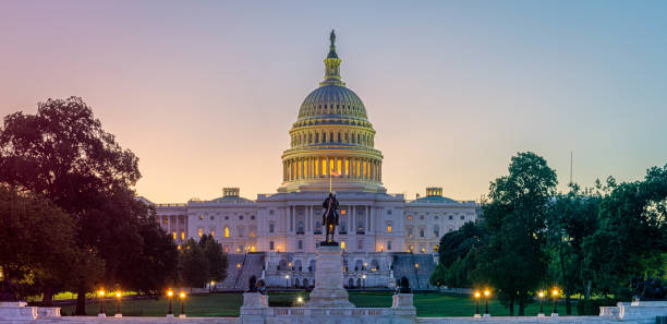 Panoramic image of the Capitol of the United States with the capitol reflecting pool stock photo