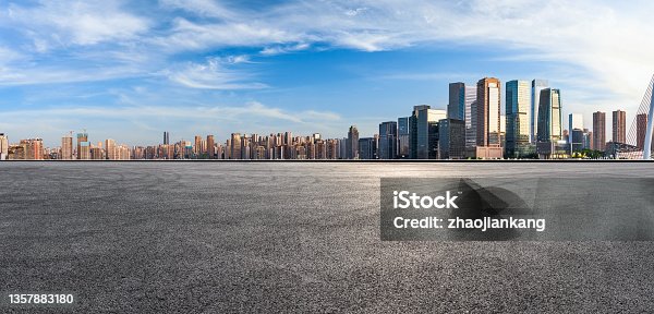 istock Panoramic skyline and modern commercial office buildings with empty road 1357883180