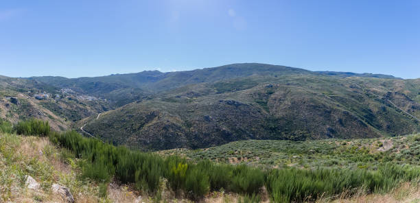 Panoramic view at the mountains of the Serra da Estrela natural park, Star Mountain Range, with Sabugueiro Village , highest village in Portugal stock photo