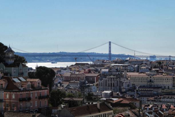 Panoramic view from the viewpoint in Lisbon Lisbon, Portugal- March 20, 2019: Beautiful views of Lisbon and the Tagus River and 25 of April bridge in the background. Portugal in a sunny day of Spring free jpeg images stock pictures, royalty-free photos & images