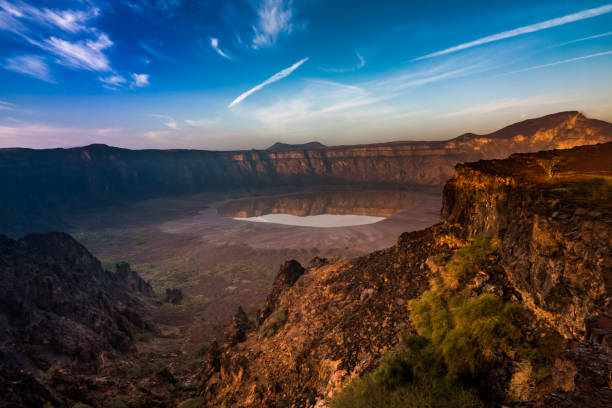 A panoramic view of Al Wahbah Crater at sunrise The crater at the early morning in December volcanic crater stock pictures, royalty-free photos & images