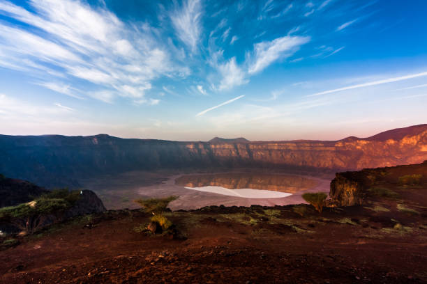 A panoramic view of Al Wahbah Crater at sunrise stock photo
