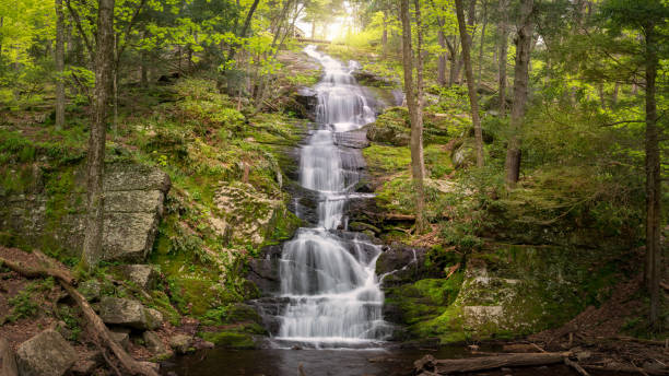 Panoramic view of Buttermilk Falls showing abundant spring runoff in Stokes State Forest, NJ Panoramic view of early spring landscape waterfalls stock pictures, royalty-free photos & images