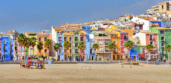 Panoramic view of colorful homes on the beach in Villajoyosa, a charming town on the Mediterranean coast of Southern Spain.