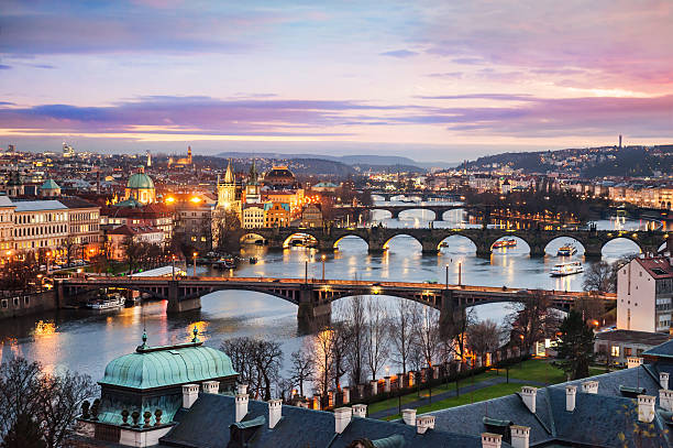 Panoramic view of Prague at night Panoramic view of bridges on Vltava river in Prague at night vltava river stock pictures, royalty-free photos & images