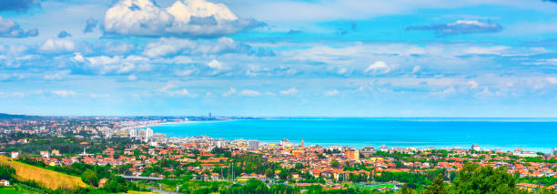 Panoramic view of Romagna coast or Riviera Romagnola, Cattolica Riccione Italy Panoramic view of Romagna coast or Riviera Romagnola, famous beach in Adriatic sea. Cattolica Riccione Italy. emilia romagna stock pictures, royalty-free photos & images