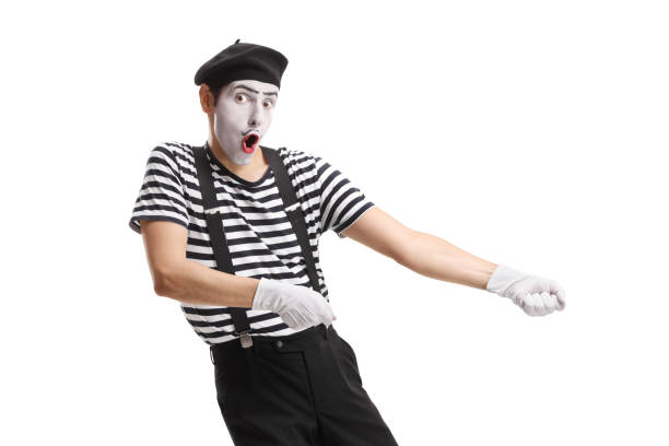 Pantomime man pulling a rope Pantomime man pulling a rope isolated on white background charades stock pictures, royalty-free photos & images