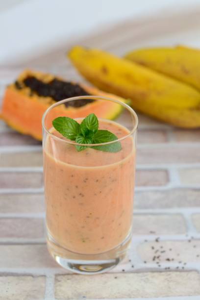 Papaya banana smoothie Papaya banana smoothie papaya smoothie stock pictures, royalty-free photos & images