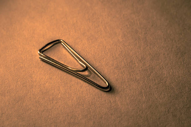 paper clip with a dimly lit vintage stock photo