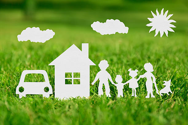 Paper cut of family with house and car Paper cut of family with house and car on green grass buy single word stock pictures, royalty-free photos & images