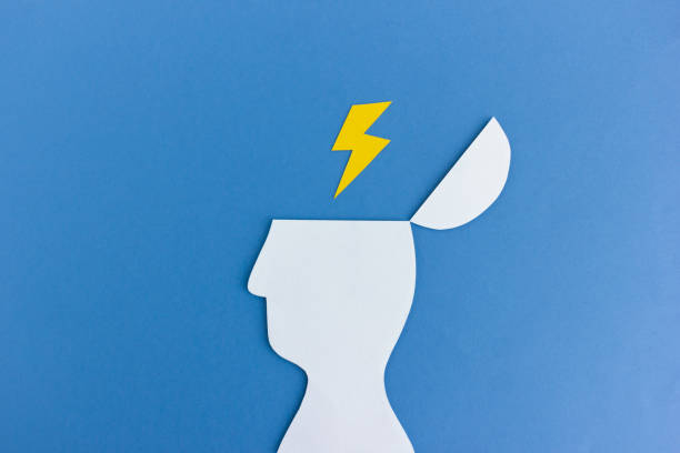 Paper man head with lightning in it stock photo