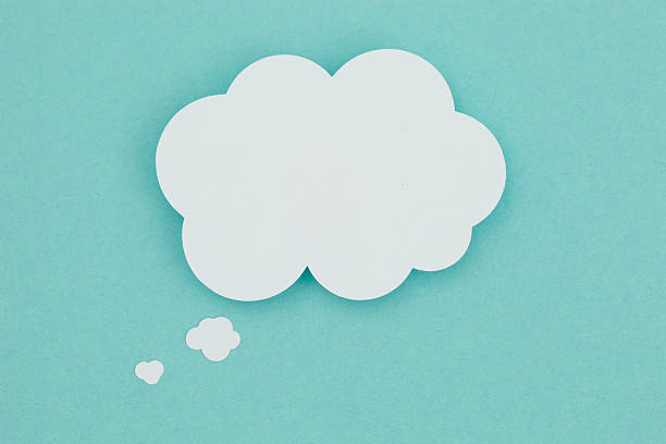 Paper thought bubble. Paper thought bubble on a blue background. day dreaming stock pictures, royalty-free photos & images