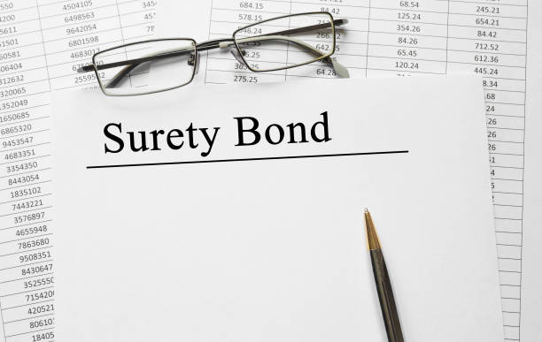 Paper with Surety Bond on a table stock photo