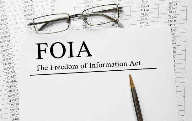 Paper with The Freedom of Information Act FOIA on a table stock photo