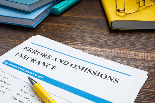 Papers with errors and omissions insurance eo form. stock photo