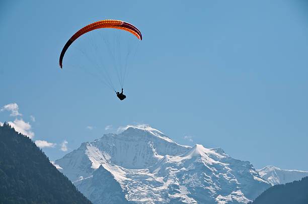 Paraglider in the mountains stock photo
