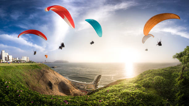 LIMA, PERU: Paraglides in Miraflores town.  peru stock pictures, royalty-free photos & images