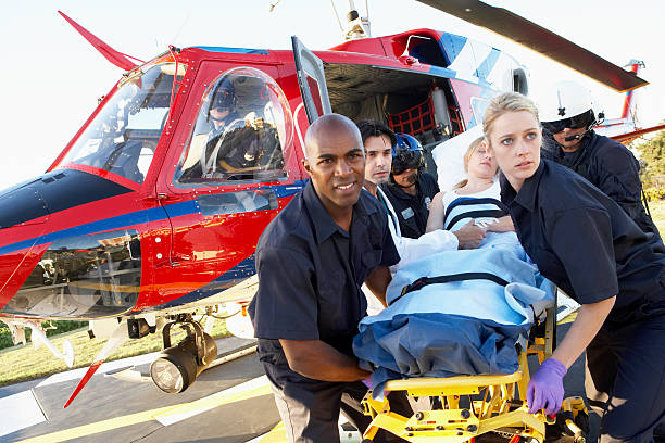 Paramedics unloading patient from Medevac  helicopter stock pictures, royalty-free photos & images
