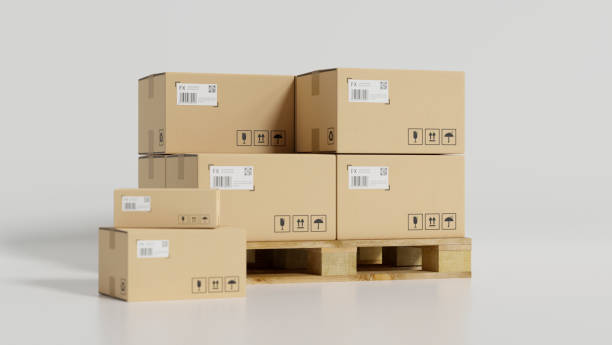 Parcel cardboard boxes on wooden pallets in white background. stock photo