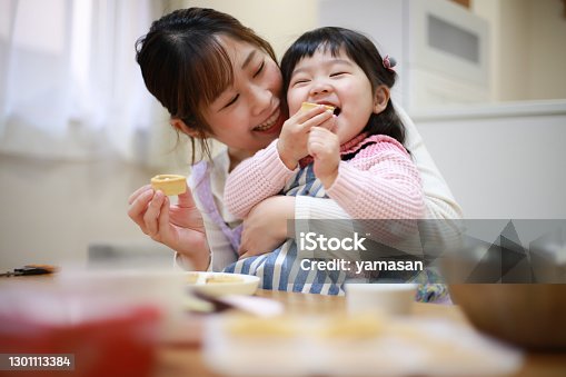 istock Parents and children eating the sweets they made 1301113384