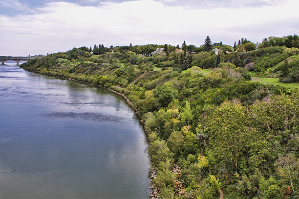 Park and trees along the South Saskatchewan Riverbank in Saskatoon stock photo