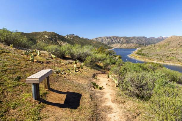 Park Bench on Piedras Pintadas Hiking Trail around Lake Hodges near Rancho Bernardo, California Scenic Landscape View of Lake Hodges and Bernardo Mountain with Park Bench in the Foreground San Diego County North Inland near California Interstate 15 lake hodges stock pictures, royalty-free photos & images