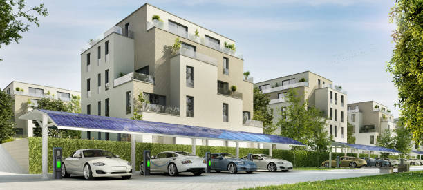 Parking for electric cars near beautiful residential buildings Modern parking for electric vehicles near luxury residential buildings electric vehicle charging station photos stock pictures, royalty-free photos & images