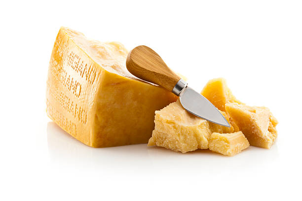 Parmesan Cheese Parmesan Cheese with Knife Isolated on White Background parmesan cheese stock pictures, royalty-free photos & images
