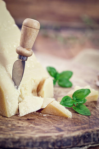 Parmesan Cheese with Basil Leaves stock photo