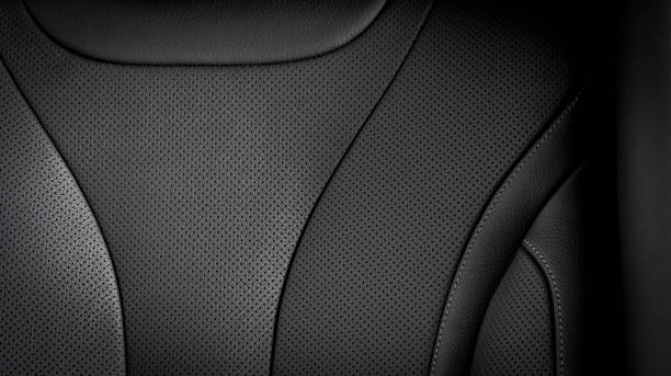 Part of  leather car seat details Part of  leather car seat details. Black perforated leather. seat stock pictures, royalty-free photos & images