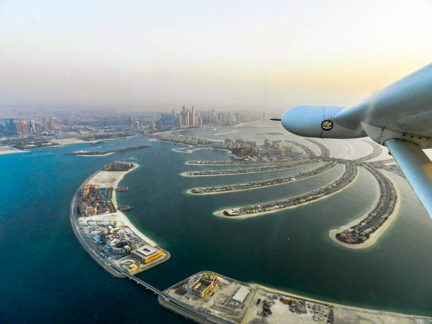 Partial Dubai skyline and Jumeirah Palm Island aerial view stock photo