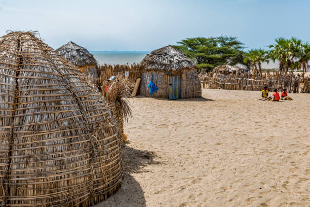 Partial view of traditional round bomas of semi-nomadic Turkana people, on shores of Lake Turkana, Kenya. stock photo
