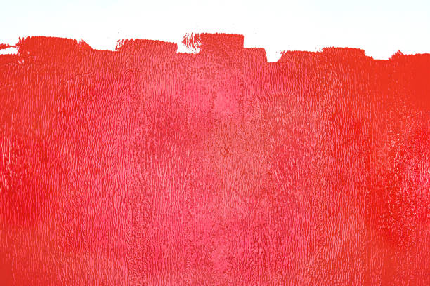 partly painted wall in red colors stock photo