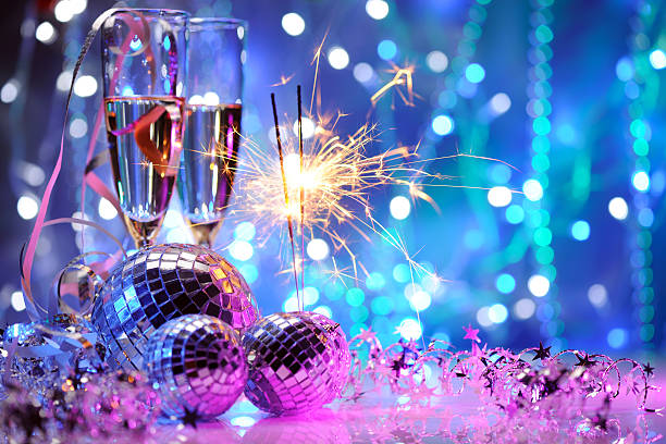 Party decoration with disco balls and fire sparkler stock photo