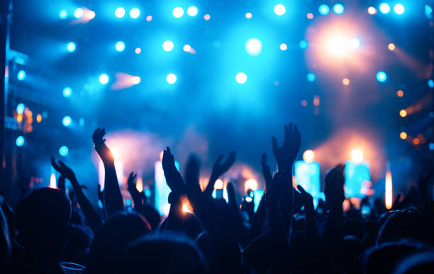 Party people enjoy concert at festival. Summer music festival stock photo