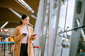 istock Passenger is using mobilephone do oline check-in at the airport 1408846019
