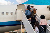 istock Passengers boarding the airplane 1334903706