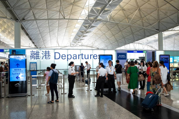 Passengers carries luggage at Hong Kong International Airport stock photo