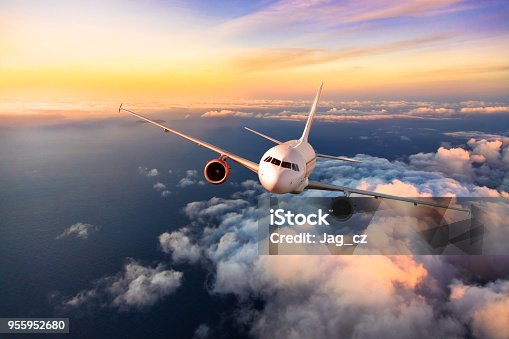 istock Passengers commercial airplane flying above clouds 955952680