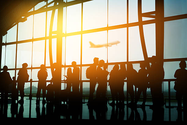 Passengers in an airport stock photo