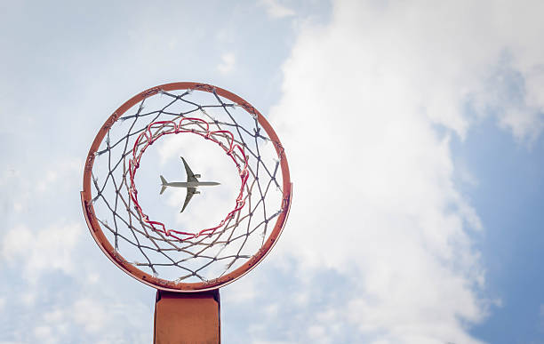 passing airliner When you look below the basketball hoop and passing airliner anchor point stock pictures, royalty-free photos & images