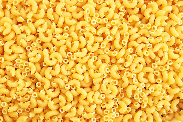 Pasta background Italian pasta closeup picture as a background. macaroni stock pictures, royalty-free photos & images
