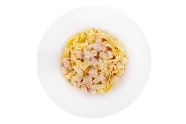 Pasta, noodles with chicken isolated white stock photo